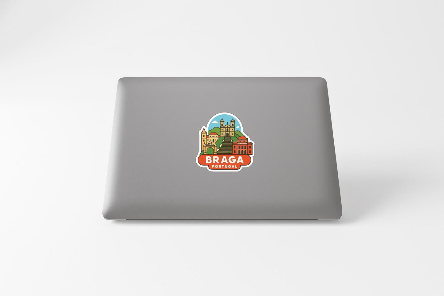 A sticker depicting the city of Braga, Portugal, on the back of a laptop computer.