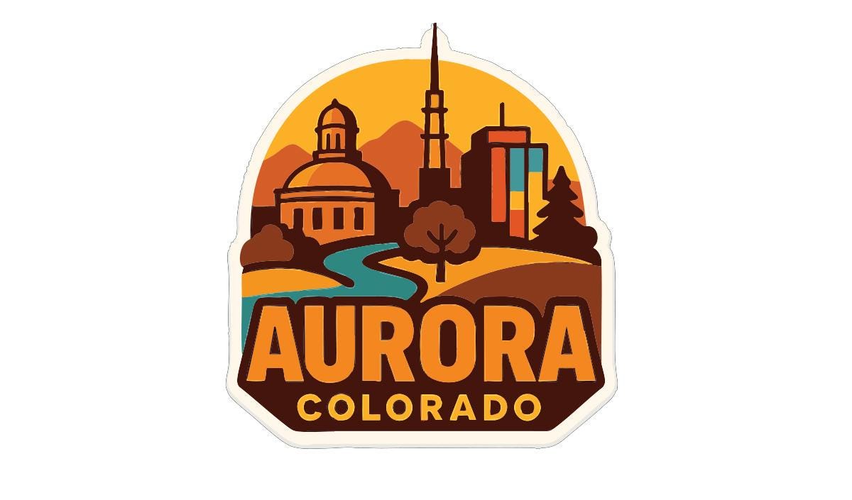 a stylized logo for Aurora, Colorado, with a cityscape and a mountain range in the background.