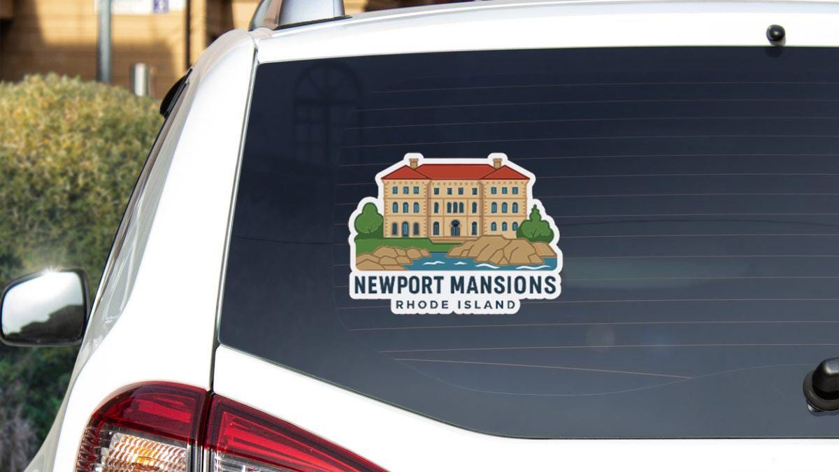 Sticker on rear window of a white car with a building illustration and text.