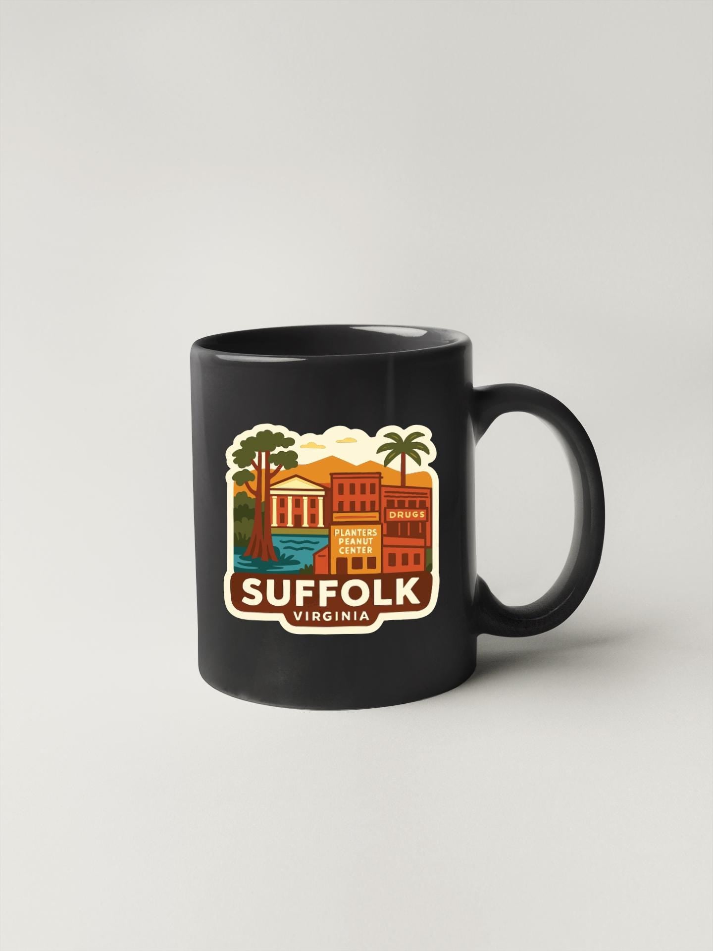 A black coffee mug with a colorful graphic depicting a town or city, along with the text "SUFFOLK VIRGINIA".