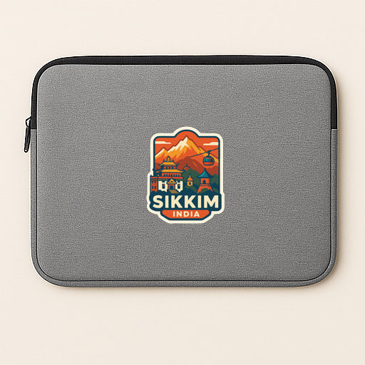 A gray laptop sleeve with a sticker that says "Sikkim India".