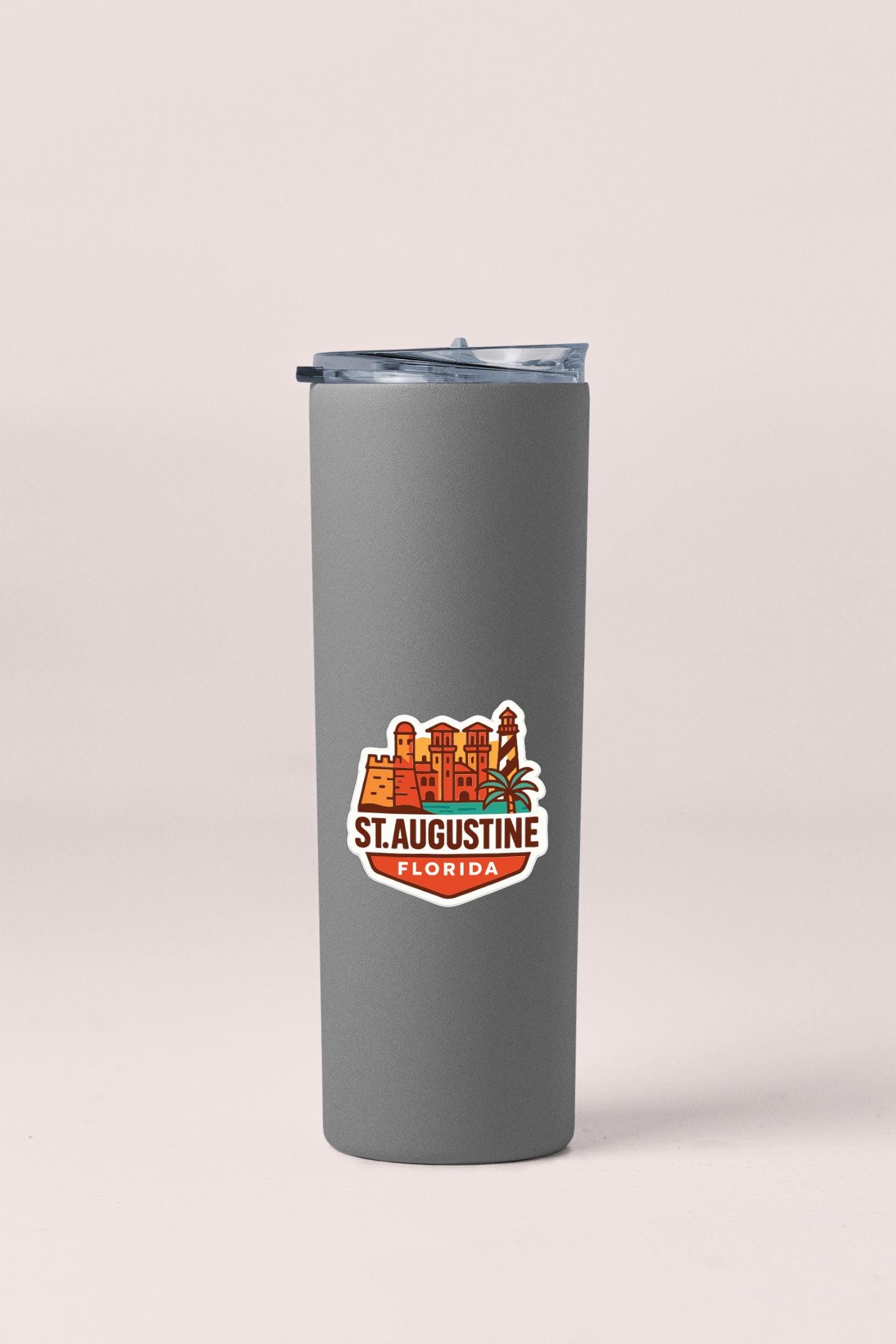 A gray insulated tumbler with a printed St. Augustine, Florida logo on it.