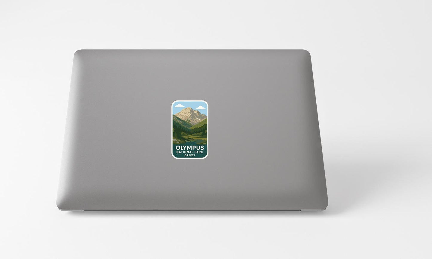A sticker with a mountain landscape on a laptop.