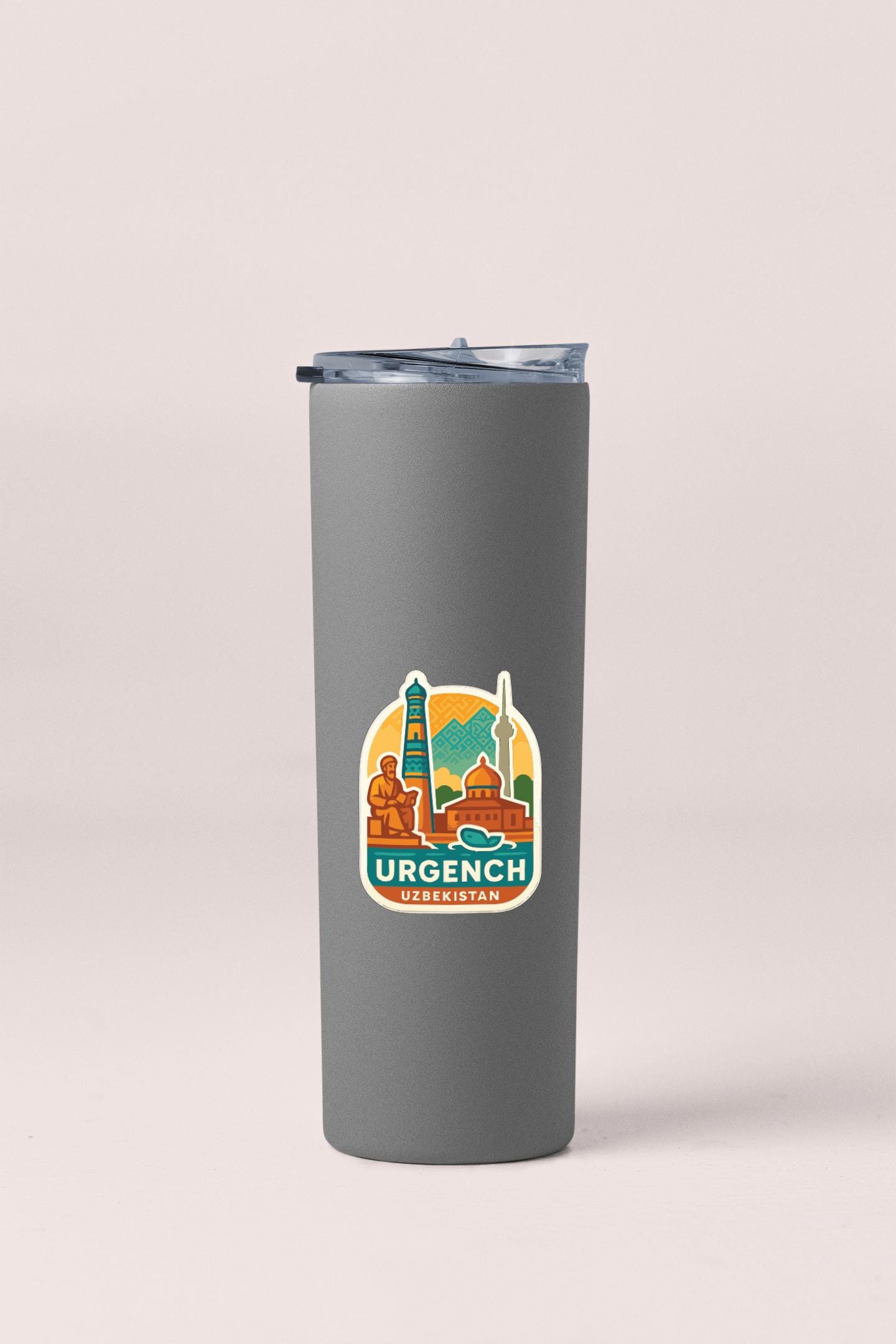 A gray insulated tumbler with a sticker depicting the Urgench, a city in the Czech Republic.