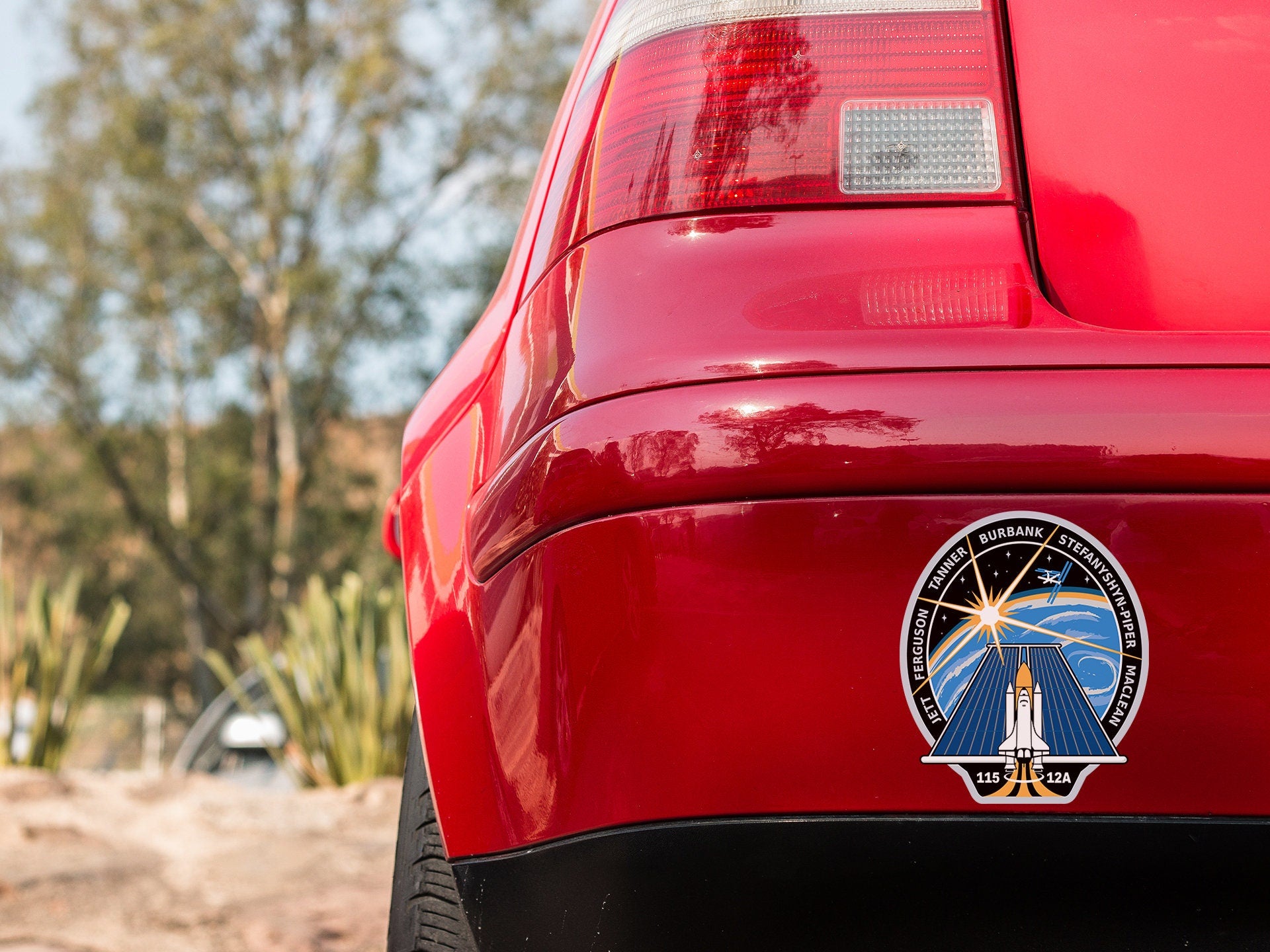 a close up of the rear end of a red car
