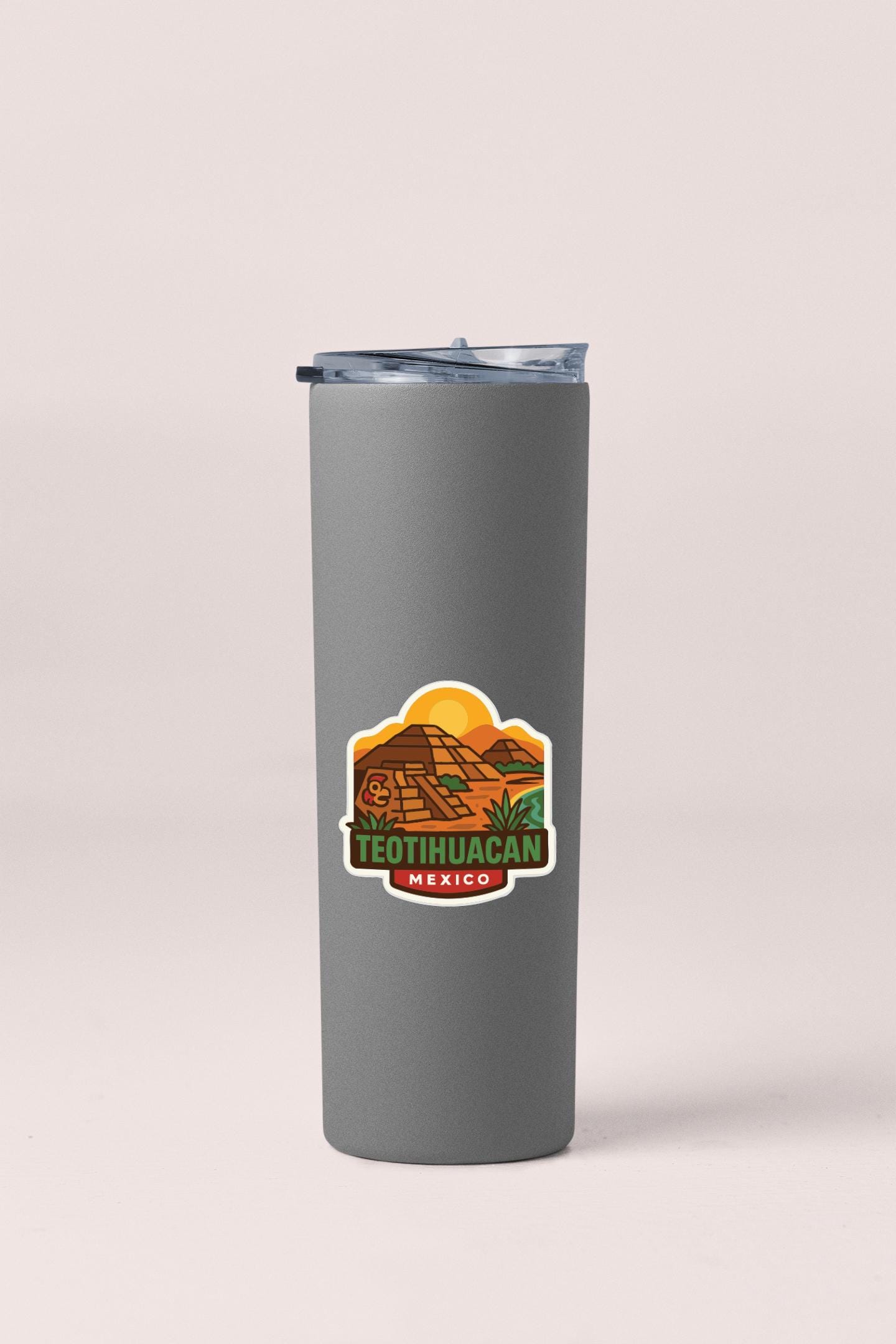 A gray insulated tumbler with a label that says "Teatihuacan Mexico" on it.