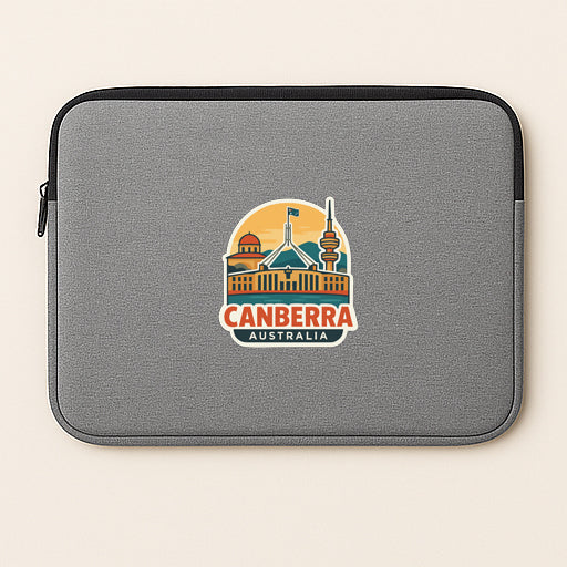 a gray laptop sleeve with a logo of a city, specifically Canberra, Australia.