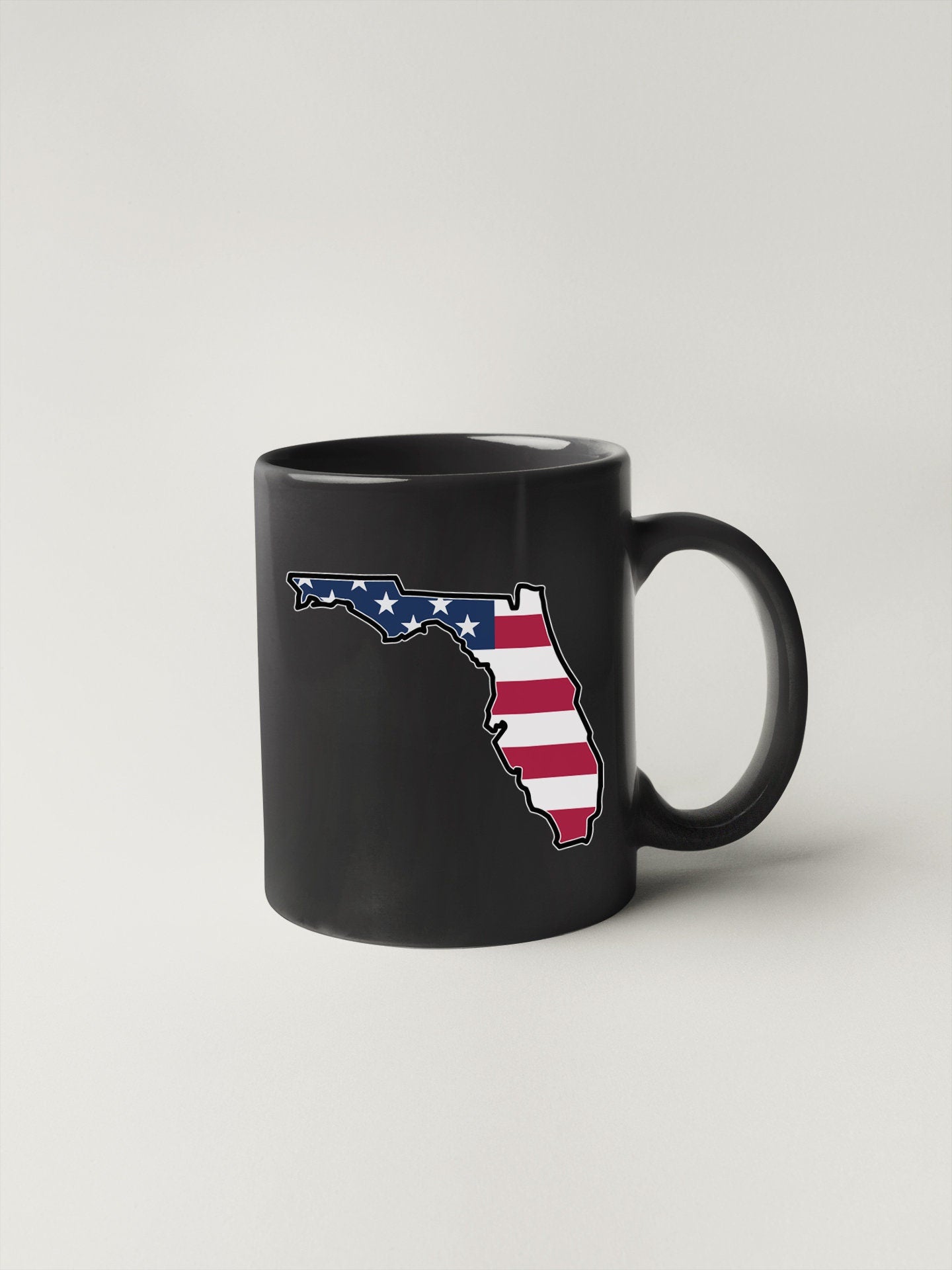 a black mug with the state of florida on it