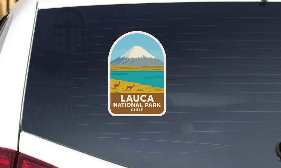 A sticker on the rear window of a vehicle, depicting a mountain landscape with a lake and llamas, representing the Lauca National Park in Chile.