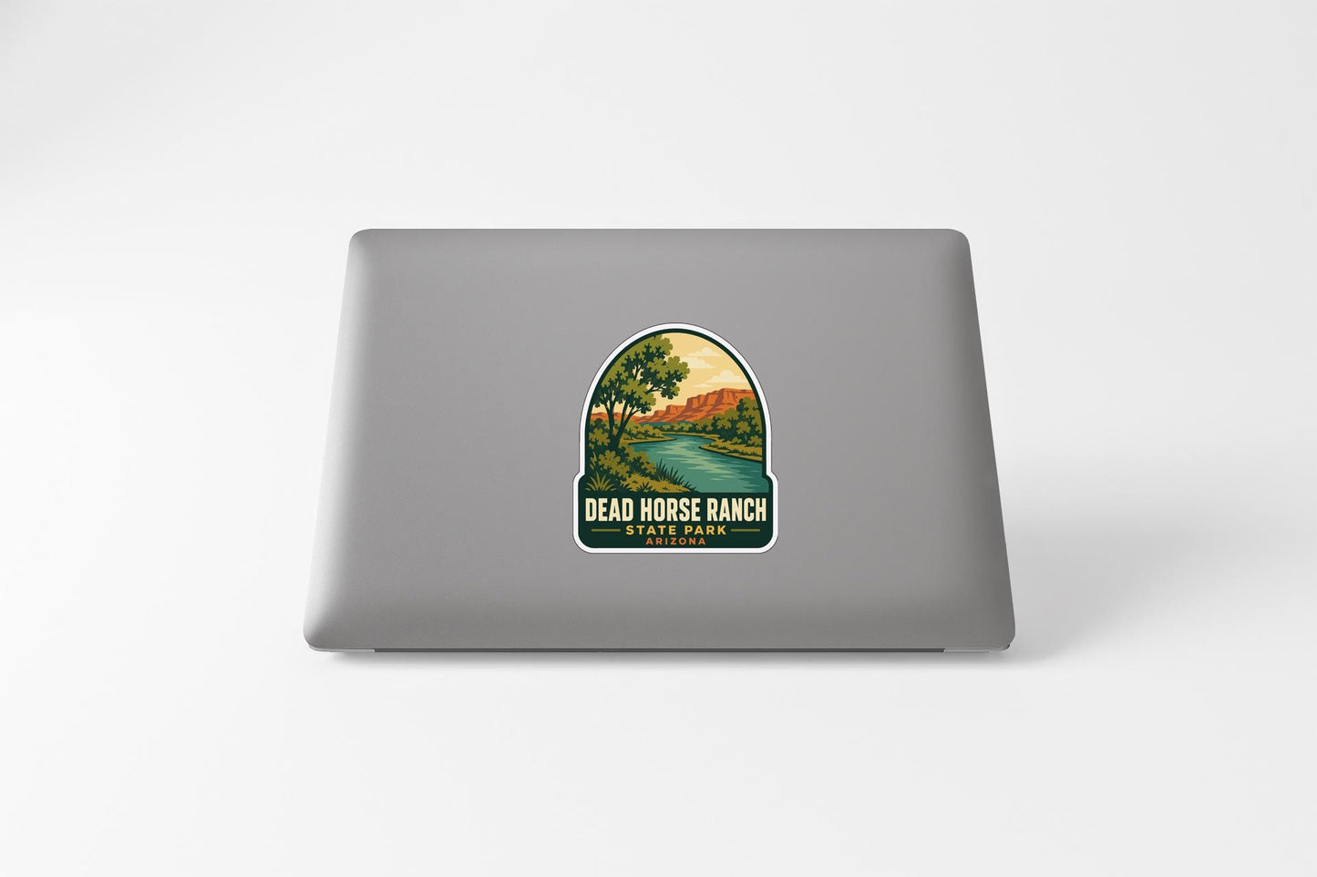 a sticker with a scenic landscape of a river and mountains, along with the text "DEAD HORSE RANCH STATE PARK".