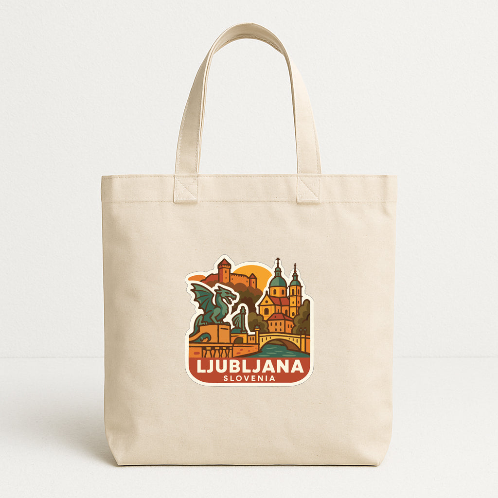 A beige tote bag with a printed design depicting the city of Ljubljana, Slovenia.
