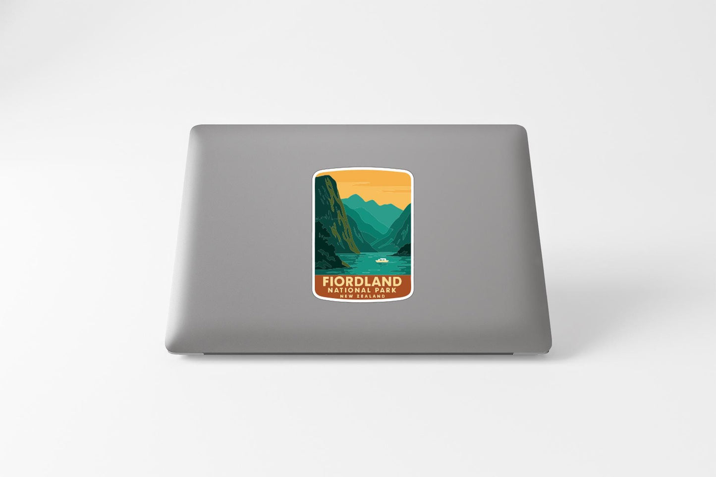 a sticker with a mountain landscape and a lake, representing the Fjordland National Park in Norway.