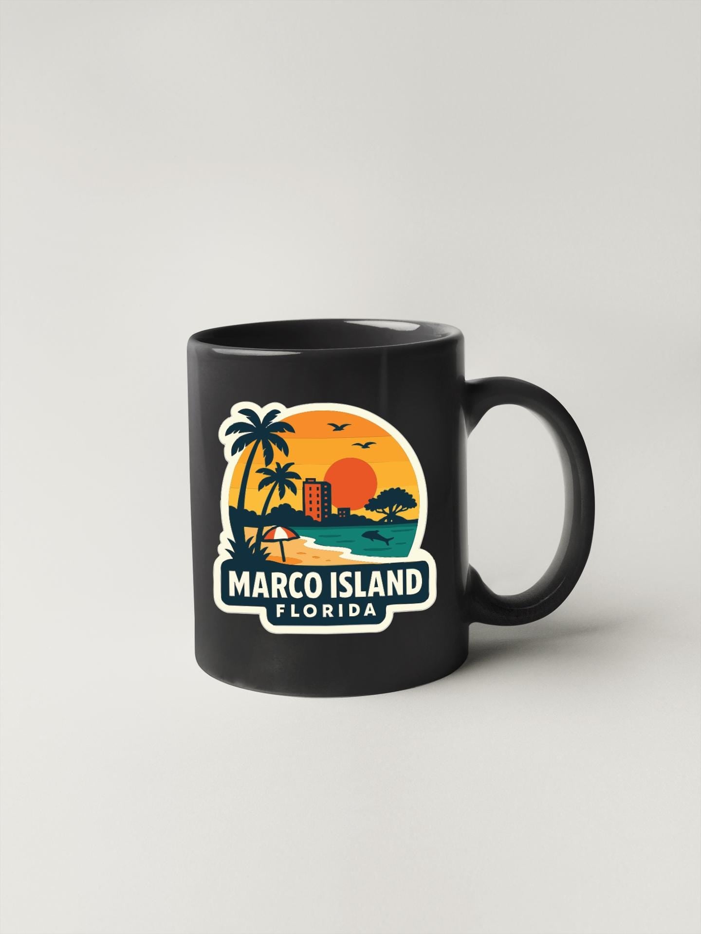 A black coffee mug with a tropical island design and the text "MARCO ISLAND FLORIDA" printed on it.