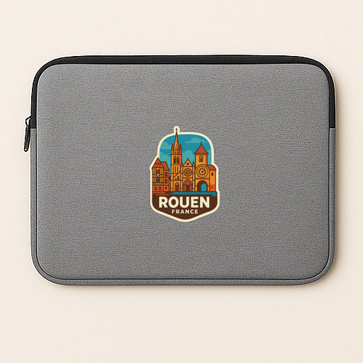 A gray laptop sleeve with a sticker of Rouen, France, printed on it.