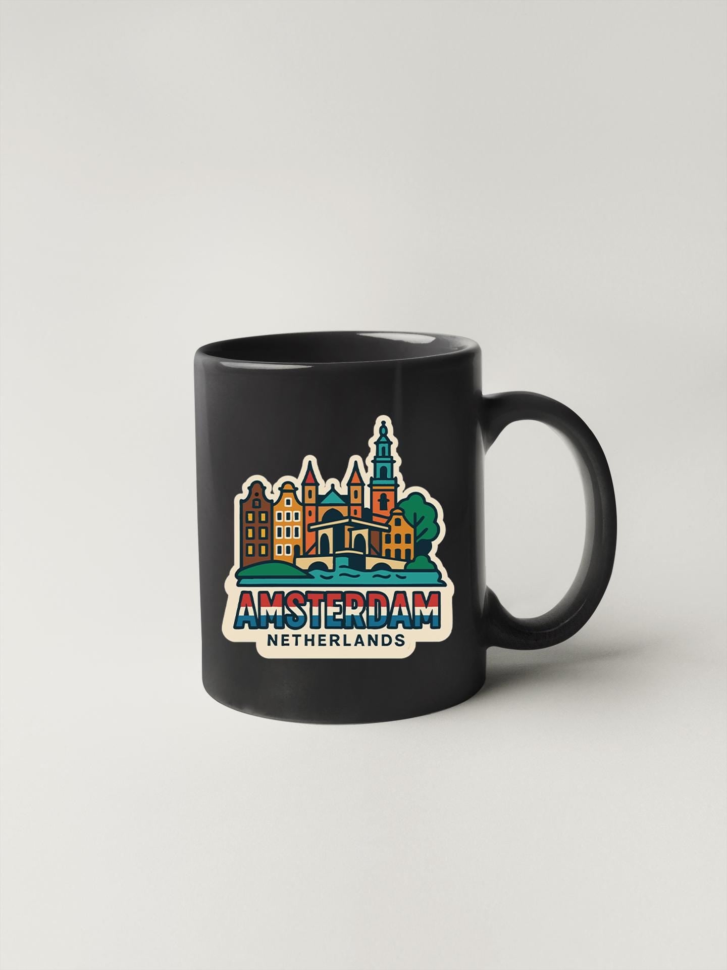a black coffee mug with the words amsterdam on it