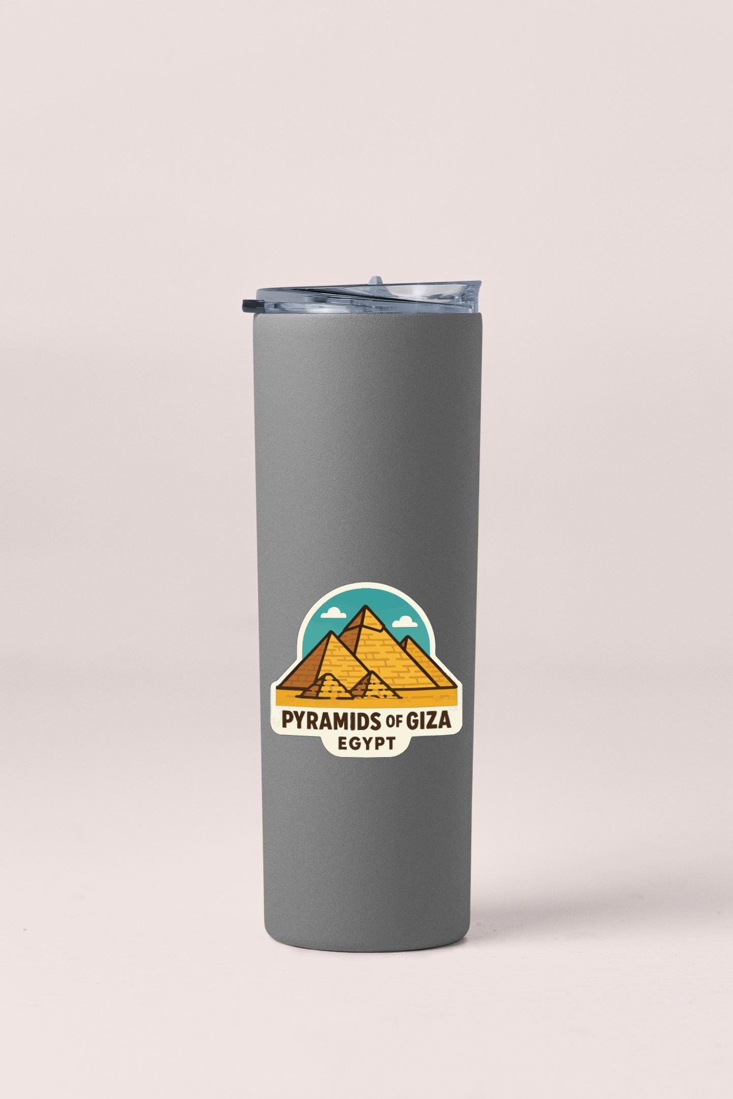 A gray insulated tumbler with a logo depicting the pyramids of Giza in Egypt.