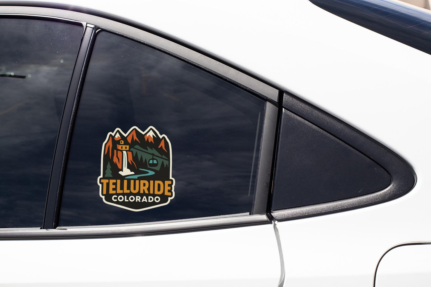 A car window with a decal that says "TELLURIDE COLORADO".