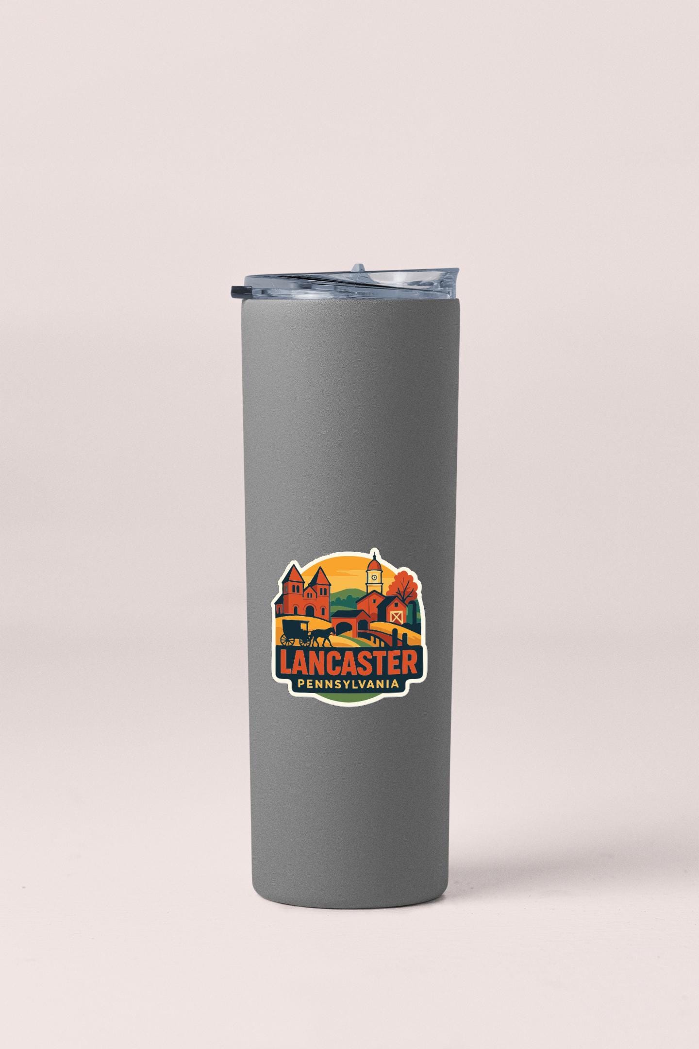 A gray insulated tumbler with a printed label that says "LANCASTER, PA" on it.