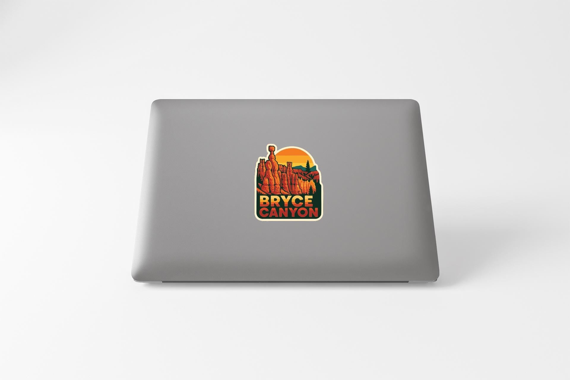 A sticker on the back of a laptop that says "Bryce Canyon".