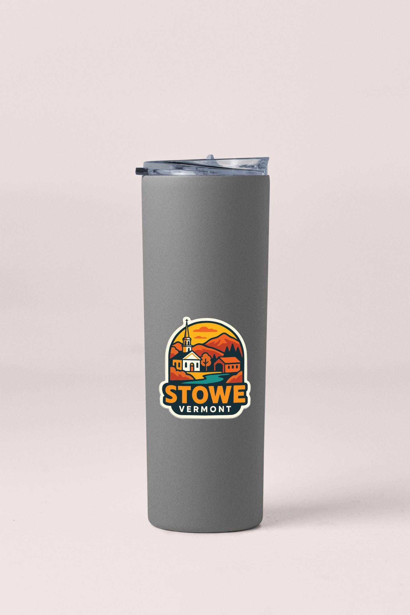 A gray insulated tumbler with a logo depicting Stowe, Vermont.
