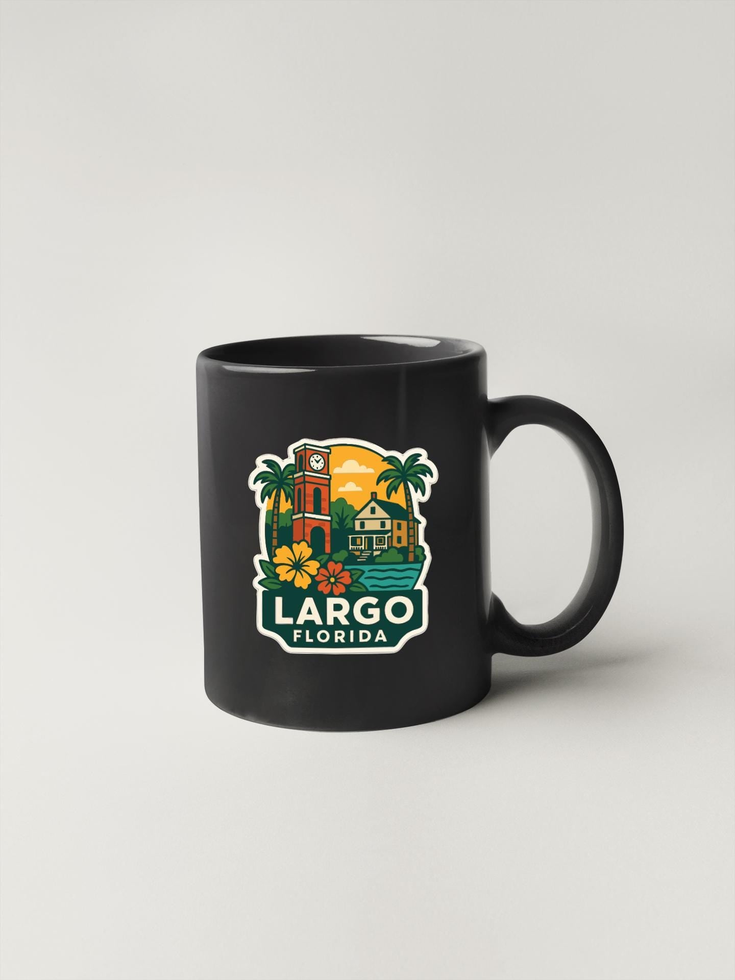 A black coffee mug with a colorful graphic depicting a tropical scene and the text "LARGO FLORIDA" printed on it.