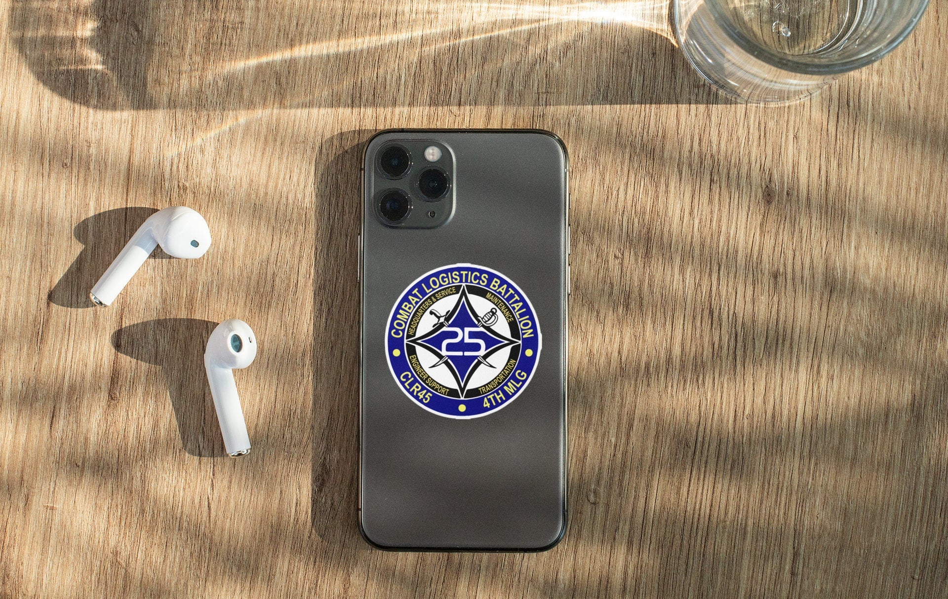 a cell phone sitting on top of a wooden table