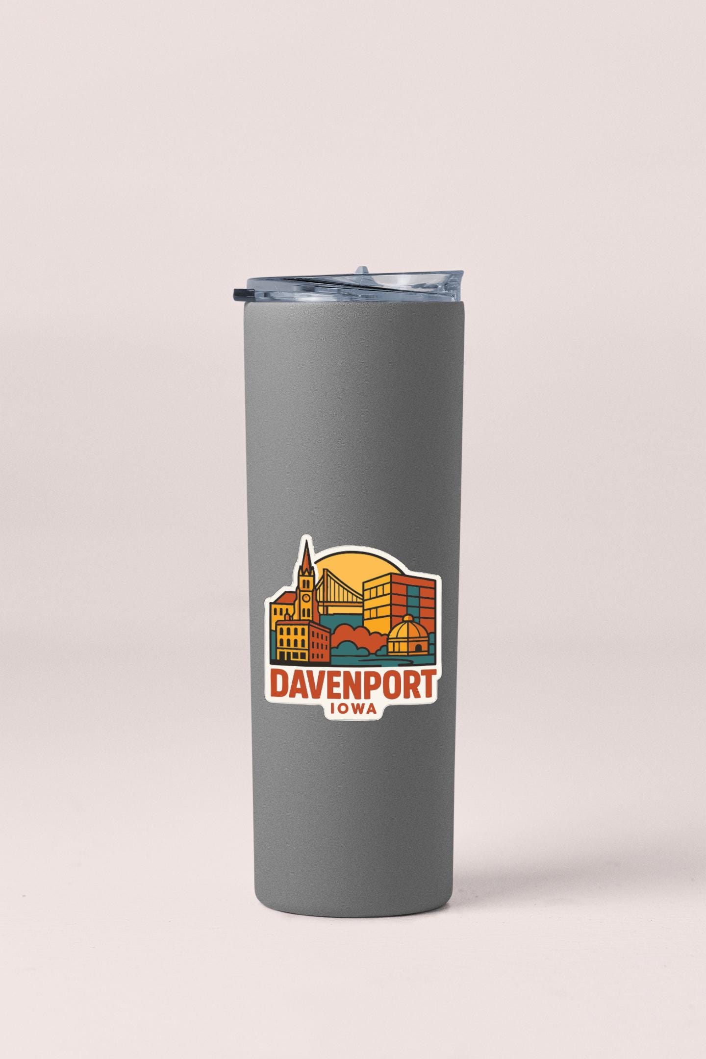 A gray insulated tumbler with a graphic design depicting the city of Davenport, Iowa.