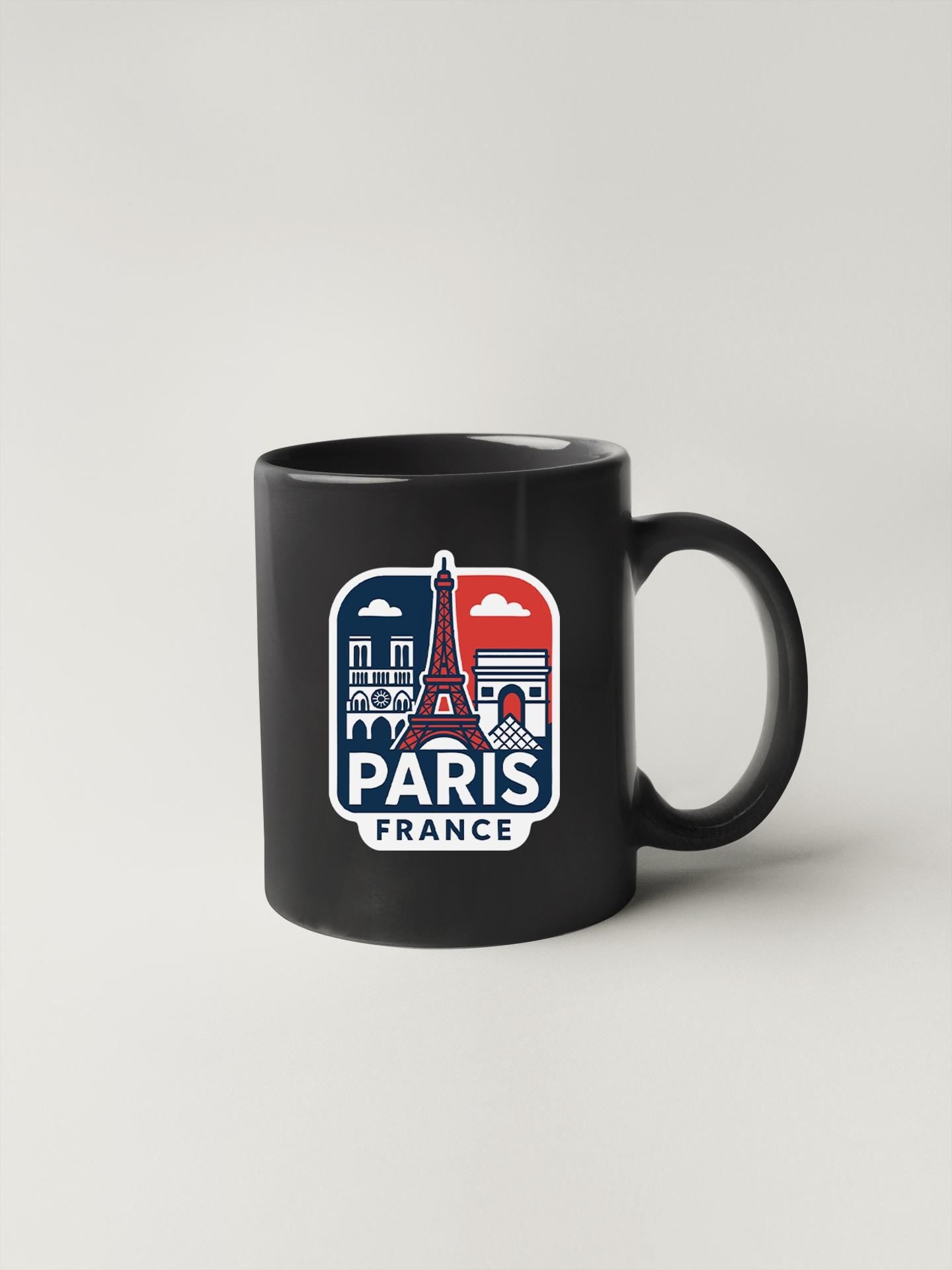 a black mug with the words paris on it