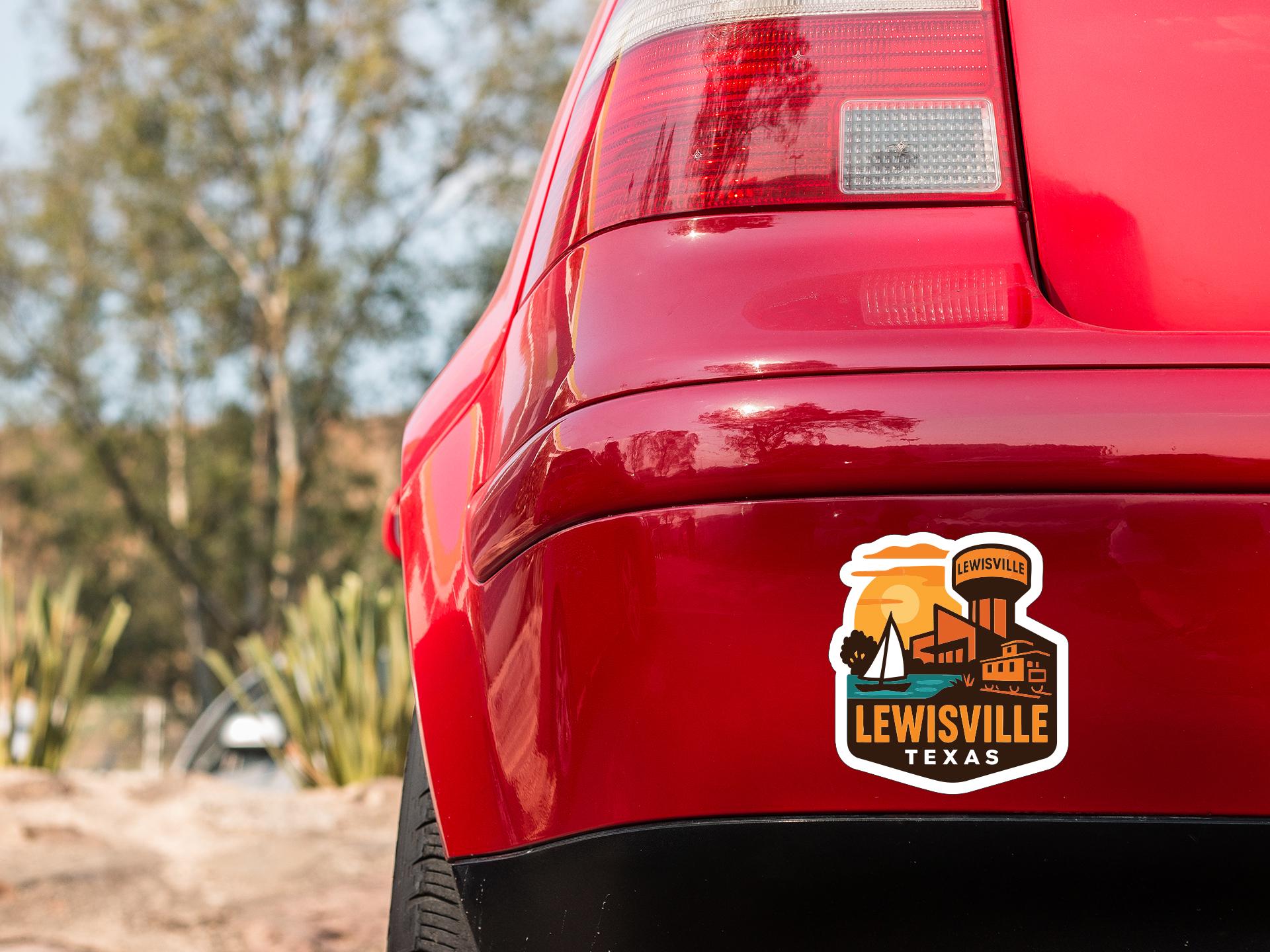 the rear end of a red car with a sticker on the trunk that says "LEWISVILLE TEXAS".