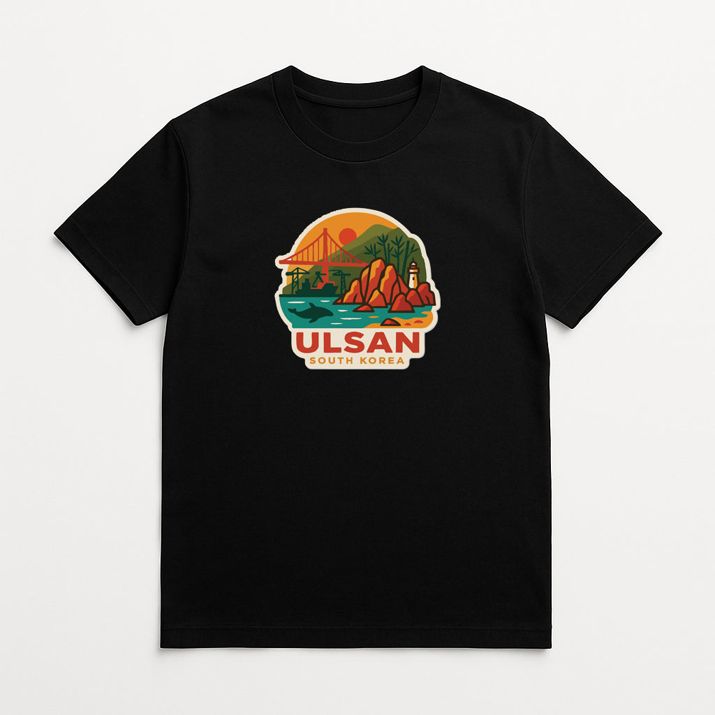 A black t-shirt with a colorful graphic design depicting a scenic landscape with mountains, a bridge, and a sunset.
