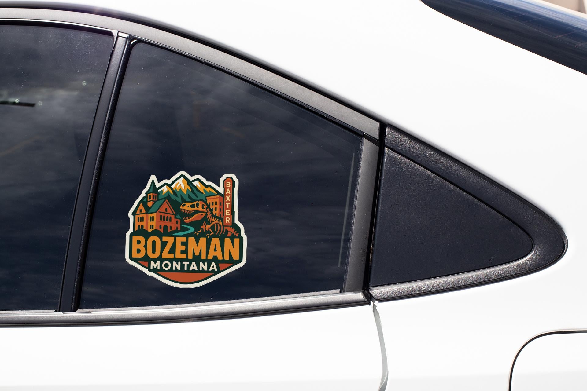 A sticker on the side of a car window, featuring a mountain landscape and the text "BOZEMAN MATTANA".