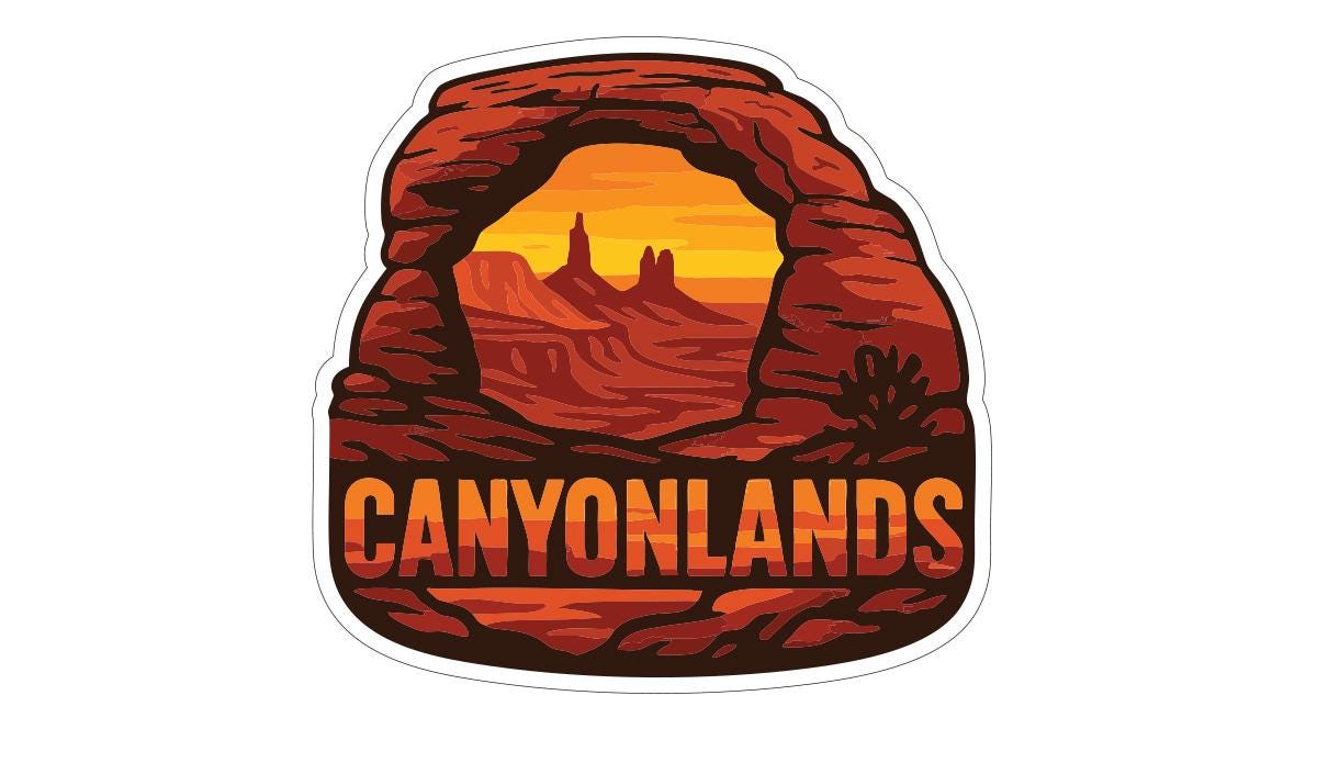 A sticker or illustration depicting a desert landscape with mountains and a sunset in the background, featuring the text "CANYONLANDS" prominently displayed.