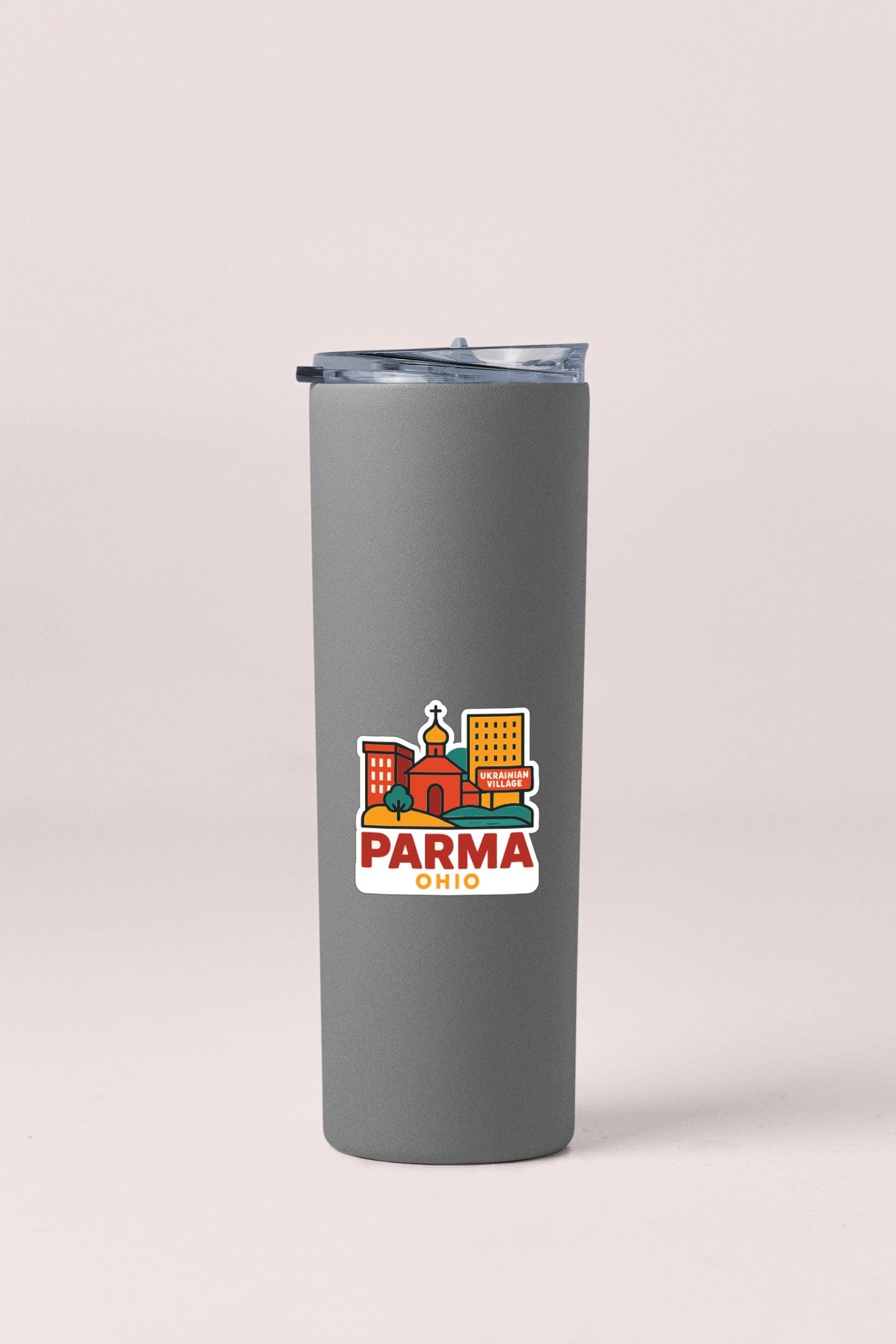 A gray insulated tumbler with a graphic design featuring a cityscape and the text "PARMA OHIO" printed on it.
