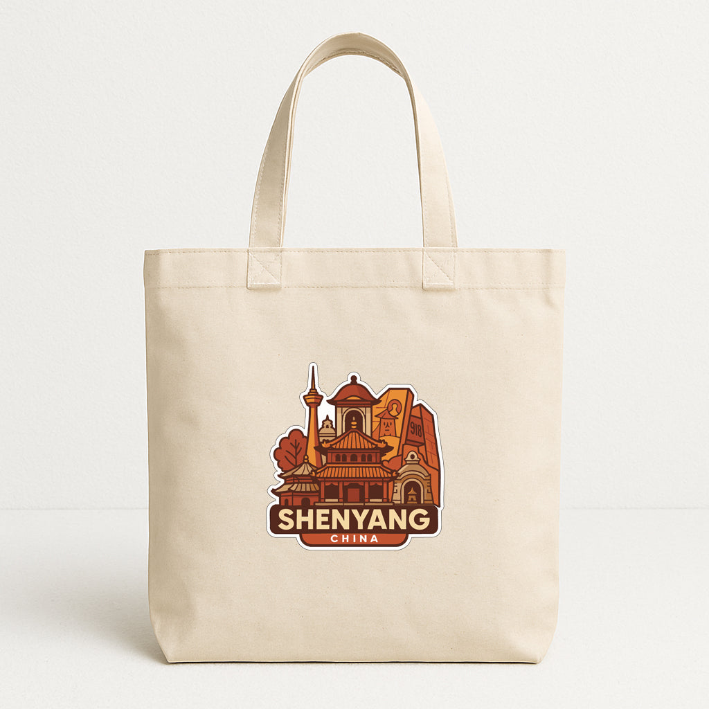 A beige tote bag with a printed design of a cityscape and the text "Shenyang China" on it.