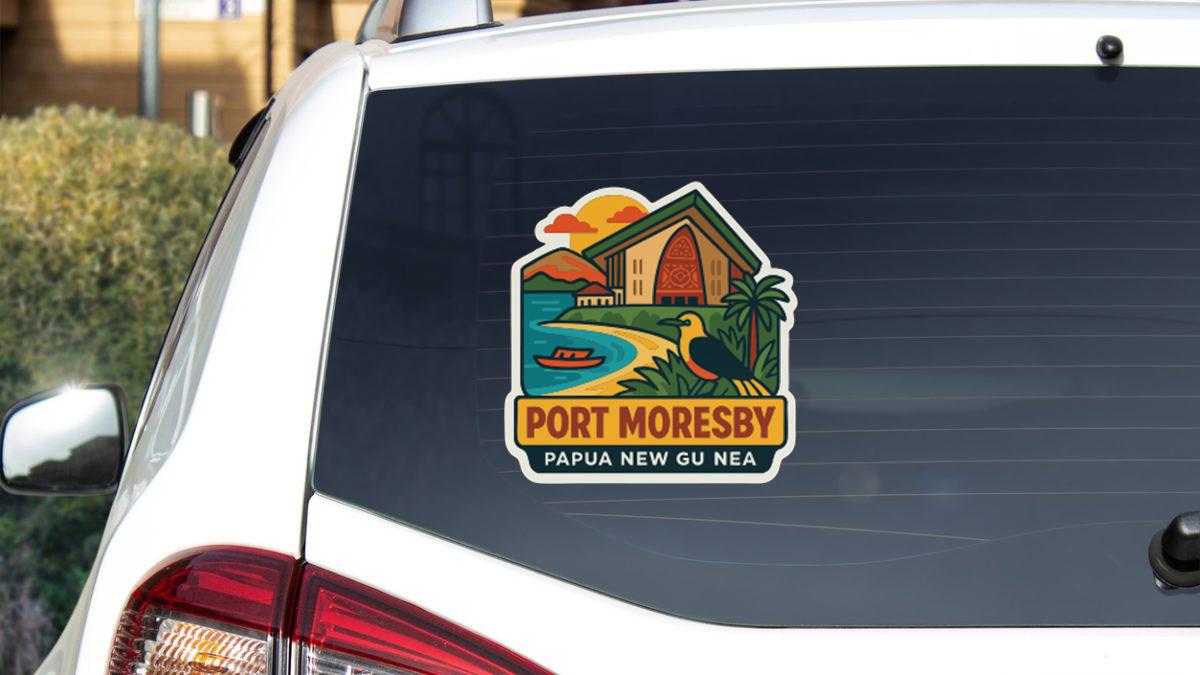 a sticker on the rear window of a car, depicting a tropical scene with a house, palm trees, and a bird.