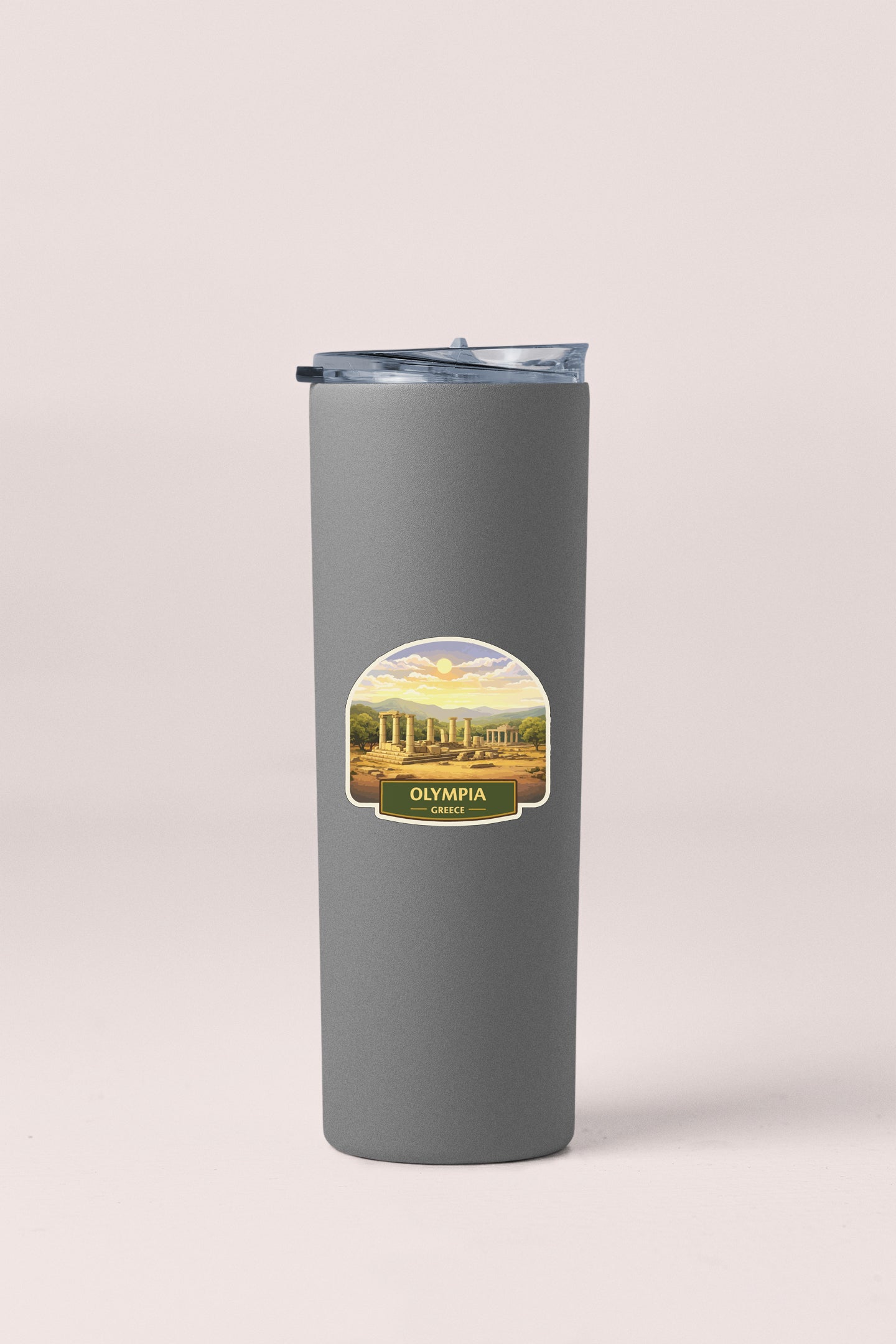 A gray insulated tumbler with a label that says "OLYMPIA" and features a scenic image of the city of Olympia.