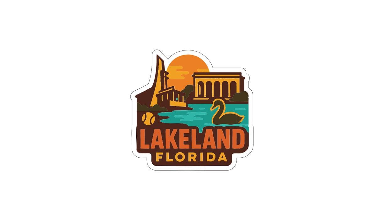 A sticker or logo depicting Lakeland, Florida, with various landmarks and elements associated with the location, such as a building, a duck, and a sunset.
