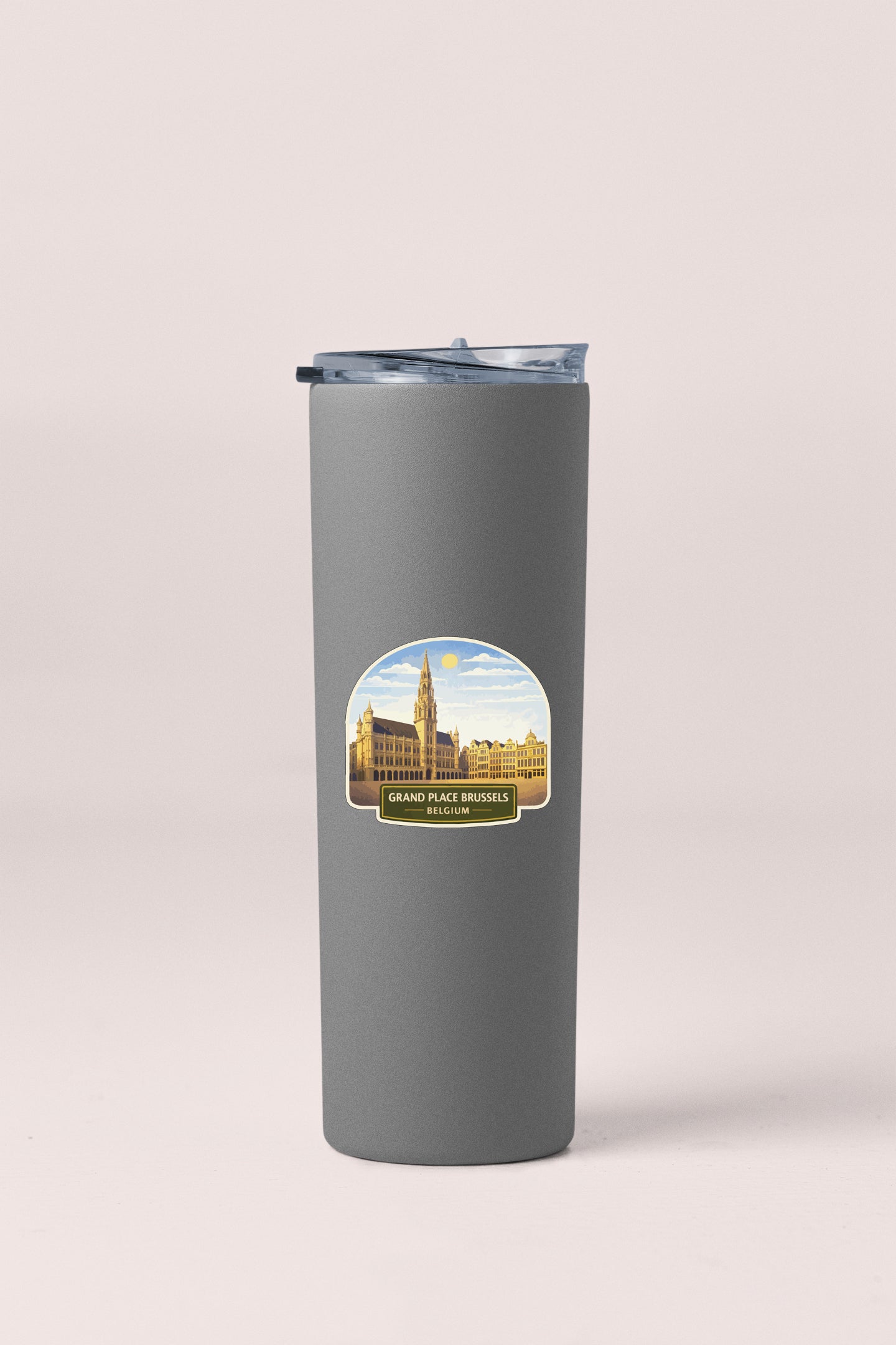 A gray insulated tumbler with a label depicting the Grand Place in Brussels, Belgium.