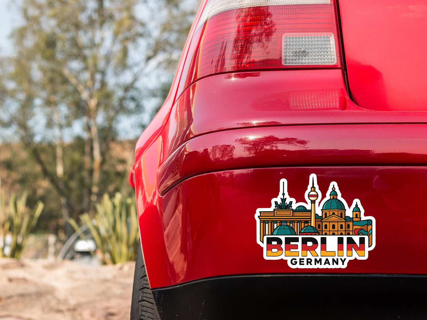 a red car with a sticker on it