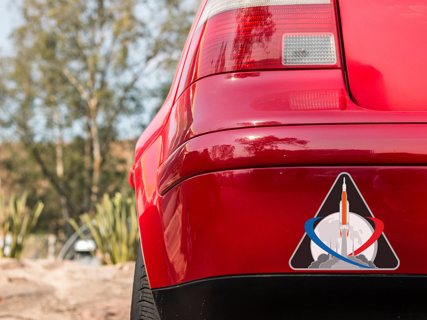 a red car with a sticker on it