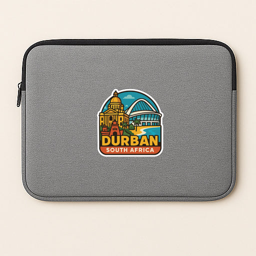 A gray laptop sleeve with a sticker depicting the city of Durban, South Africa.