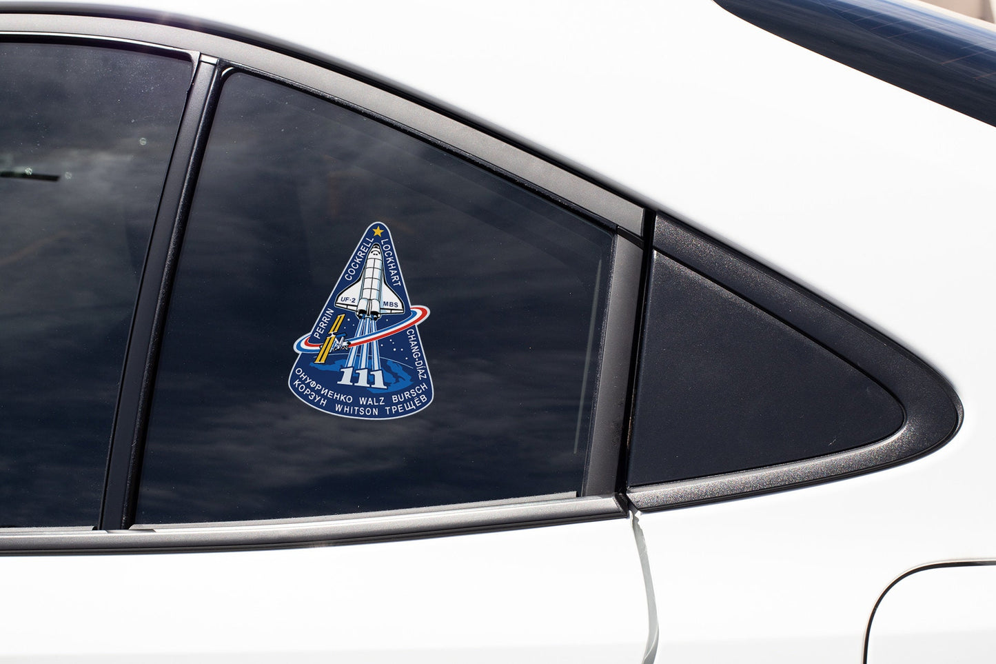 a close up of a car window with a sticker on it