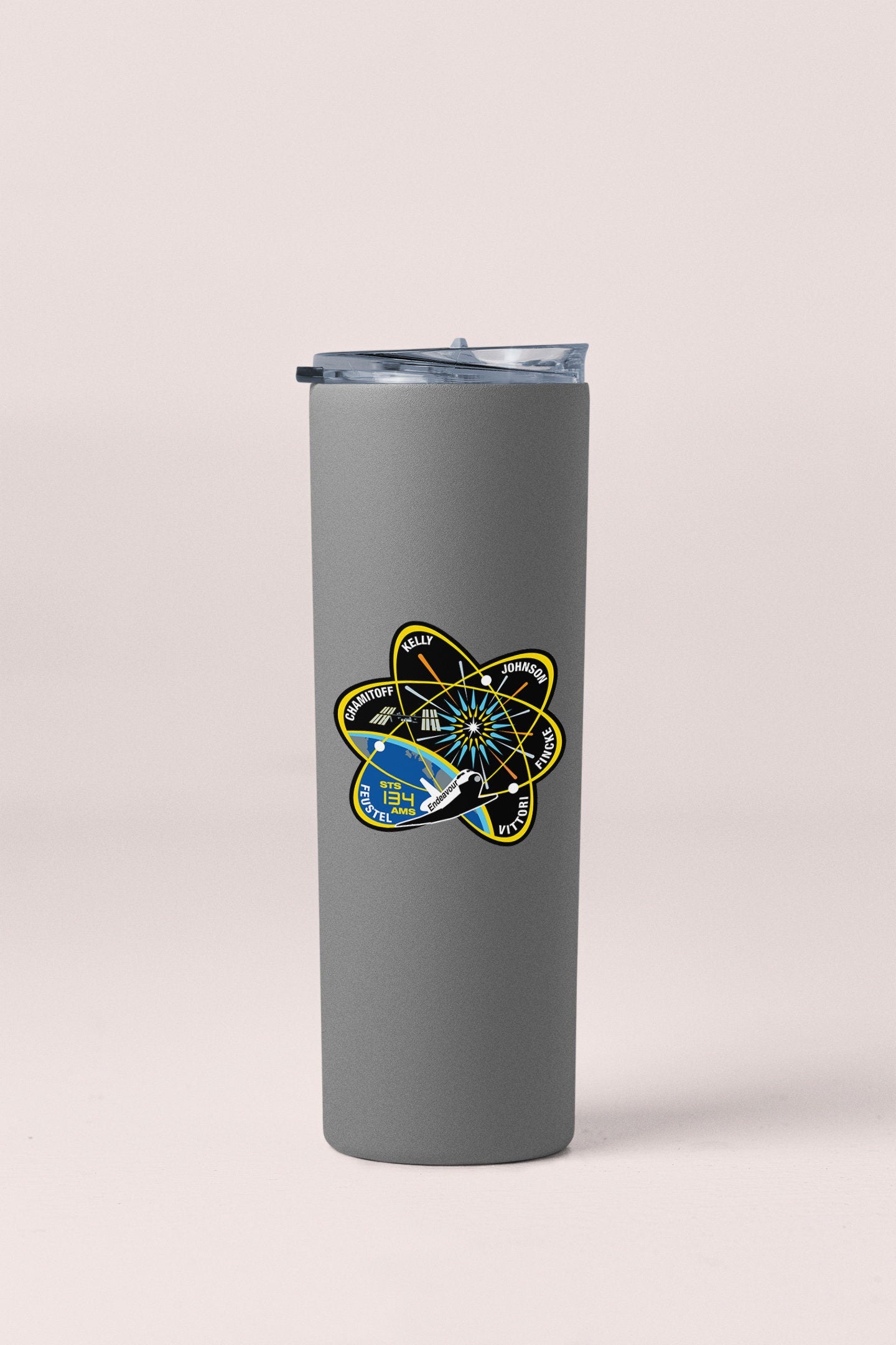 a stainless steel tumbler with a picture of a fish on it