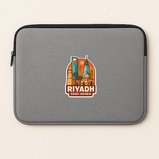 a gray laptop sleeve with a sticker of Riyadh, Saudi Arabia, prominently displayed on it.