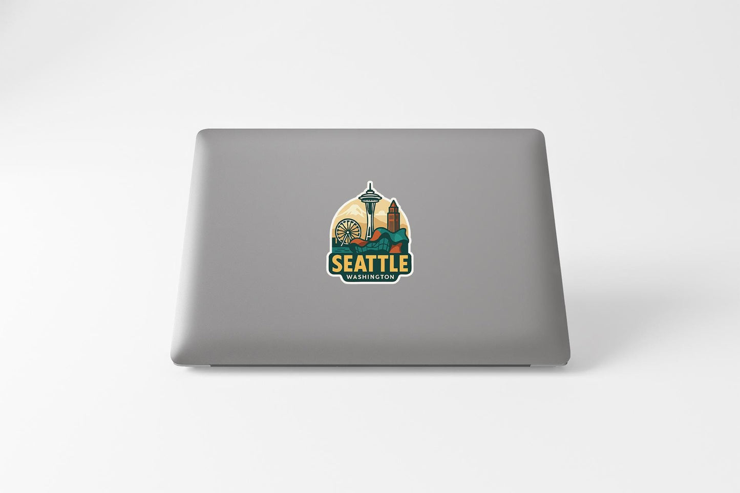 a laptop with a seattle sticker on it