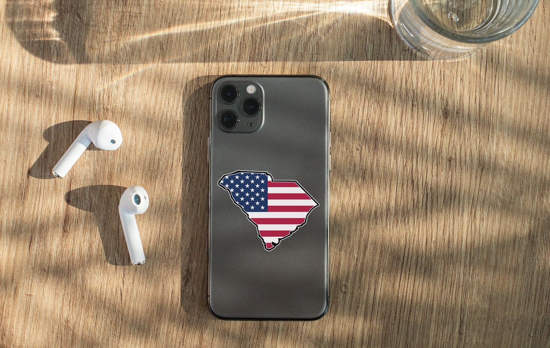 a cell phone with a sticker of the state of texas