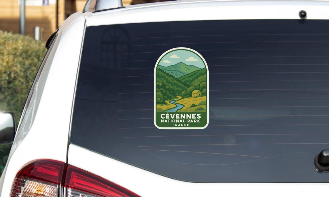 a sticker on the rear window of a car that says "Cévennes National Park, France".