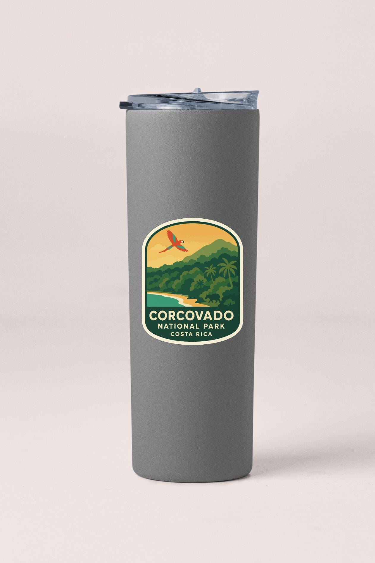A gray insulated tumbler with a label that says "CORCOVADO NATIONAL PARK, COSTA RICA".