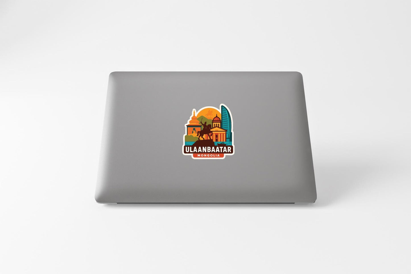 a sticker with a colorful illustration of a building and a horse, along with the text "ULAANBAATAR" and "MONGOLIA" printed on it.
