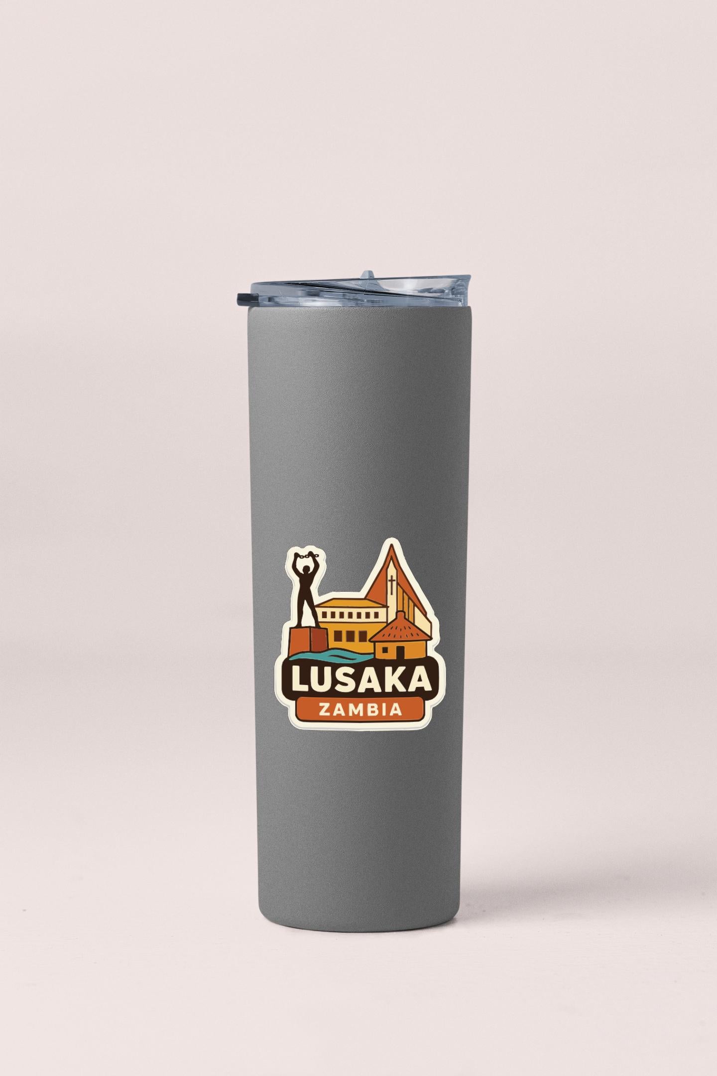 A gray insulated tumbler with a printed label that says "LUSAKA ZAMBIA".